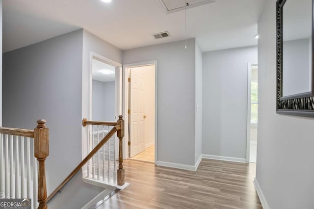 5244 Carrington Park Dr, Powder Springs, GA 30127 - hall featuring visible vents, an upstairs landing, wood finished floors, and attic access