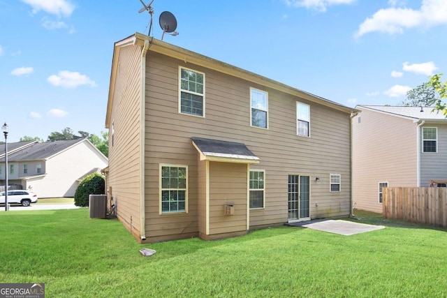 5244 Carrington Park Dr, Powder Springs, GA 30127 - rear view of house featuring central AC unit, fence, and a yard