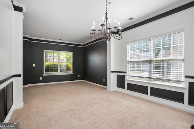 5244 Carrington Park Dr, Powder Springs, GA 30127 - carpeted empty room with baseboards, a notable chandelier, ornamental molding, and visible vents