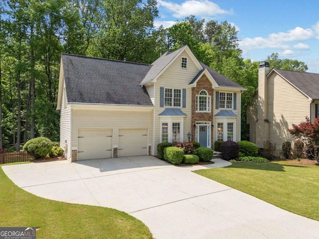 1126 Gate Post Ct, Powder Springs, GA 30127 - colonial home featuring a front lawn, stone siding, roof with shingles, concrete driveway, and an attached garage