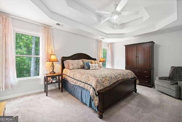 1126 Gate Post Ct, Powder Springs, GA 30127 - bedroom featuring light colored carpet, a raised ceiling, a ceiling fan, baseboards, and visible vents