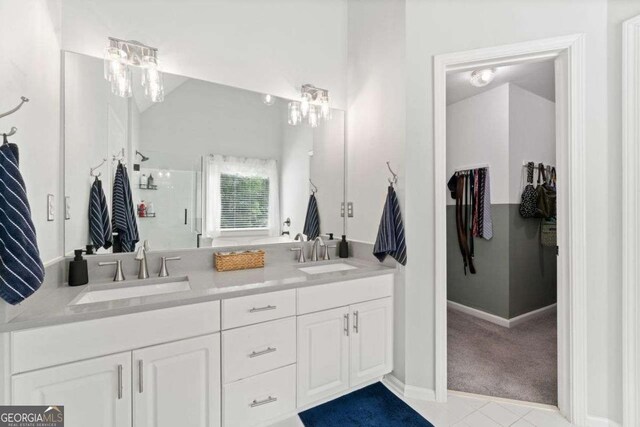 1126 Gate Post Ct, Powder Springs, GA 30127 - bathroom featuring a sink, tile patterned flooring, a stall shower, and double vanity