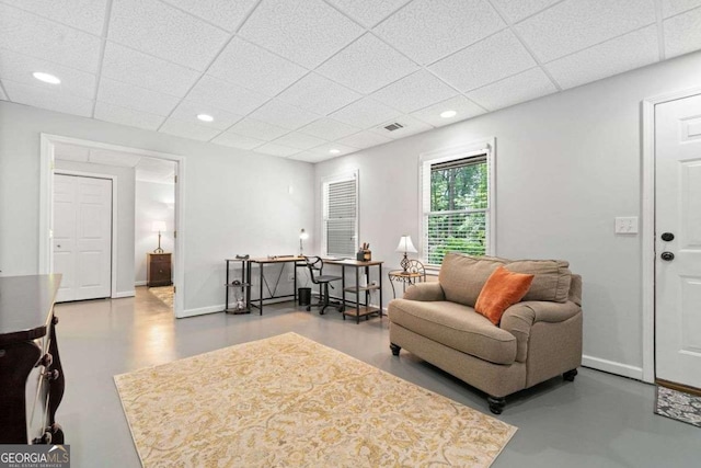 1126 Gate Post Ct, Powder Springs, GA 30127 - living area with finished concrete flooring, recessed lighting, baseboards, a drop ceiling, and visible vents