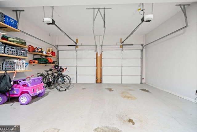 1126 Gate Post Ct, Powder Springs, GA 30127 - garage featuring a garage door opener