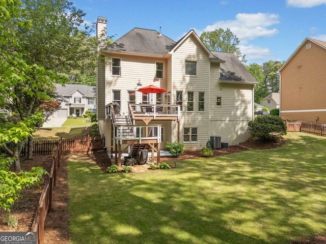 1126 Gate Post Ct, Powder Springs, GA 30127 - back of house with fence, stairs, a deck, a chimney, and a lawn