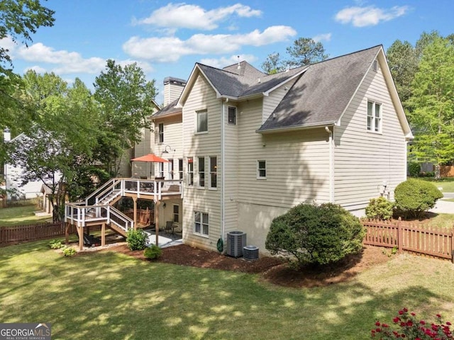 1126 Gate Post Ct, Powder Springs, GA 30127 - rear view of property with stairs, a fenced backyard, a lawn, and a wooden deck