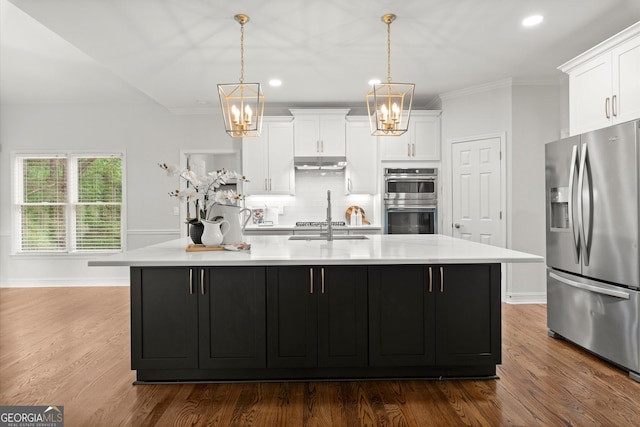 kitchen featuring stainless steel appliances, dark wood finished floors, white cabinetry, a chandelier, and light countertops