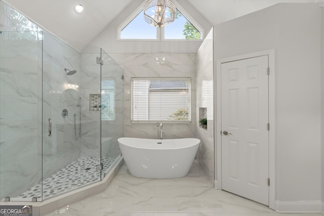 full bath with a marble finish shower, vaulted ceiling, marble finish floor, and a notable chandelier