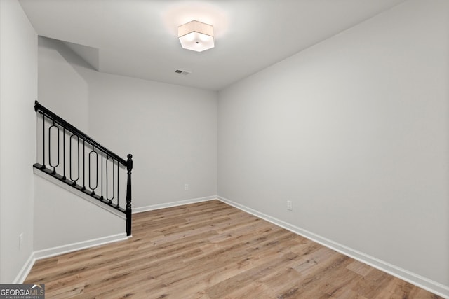 interior space featuring light wood finished floors, visible vents, and baseboards