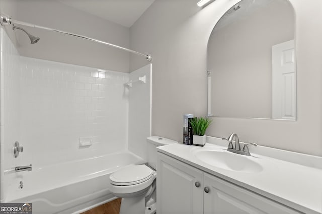 bathroom featuring toilet, vanity, shower / bathing tub combination, and wood finished floors