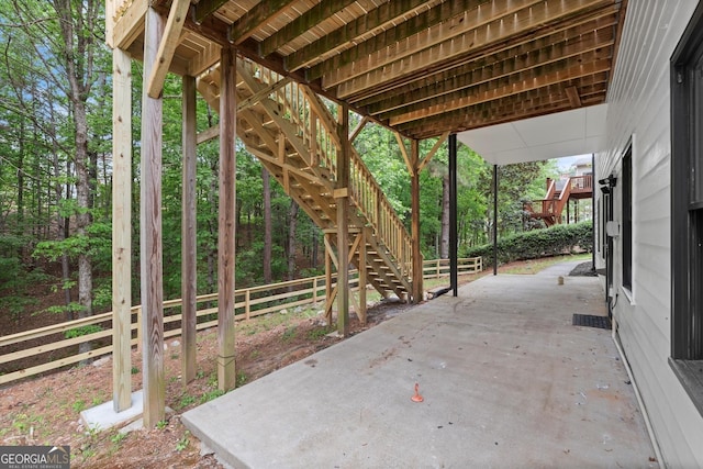 view of patio / terrace with stairs and fence