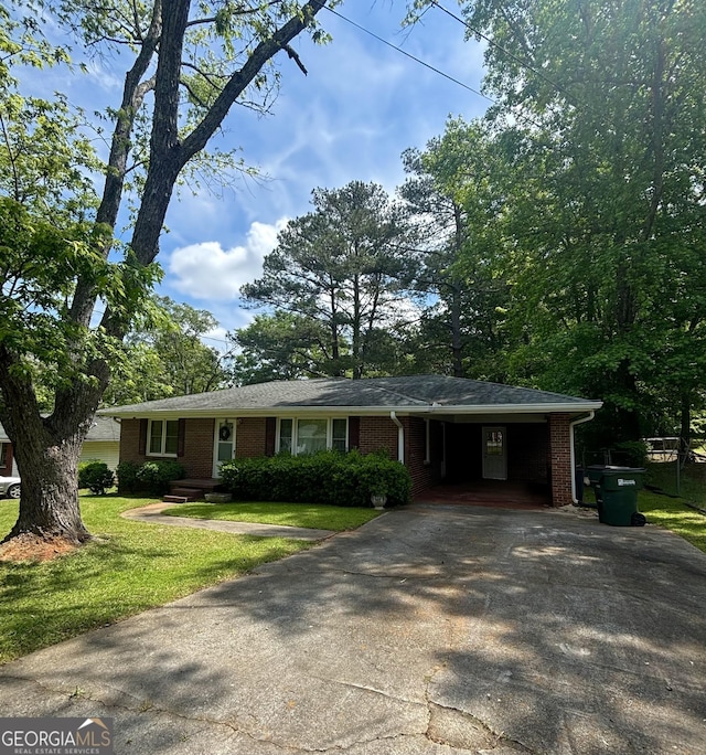 9163 Fair St SW, Covington, GA 30014 - single story home featuring brick siding, a carport, a front lawn, and concrete driveway