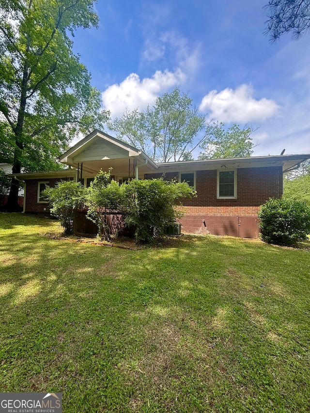 9163 Fair St SW, Covington, GA 30014 - back of property with a lawn and brick siding