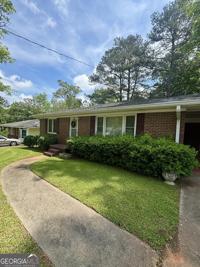9163 Fair St SW, Covington, GA 30014 - single story home with a front yard and brick siding