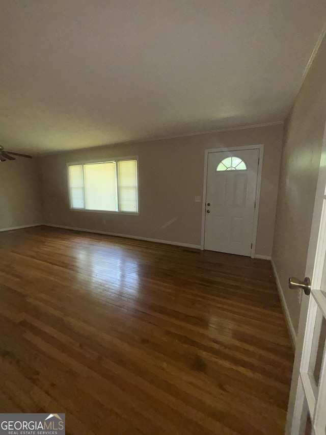 9163 Fair St SW, Covington, GA 30014 - foyer featuring baseboards and wood finished floors