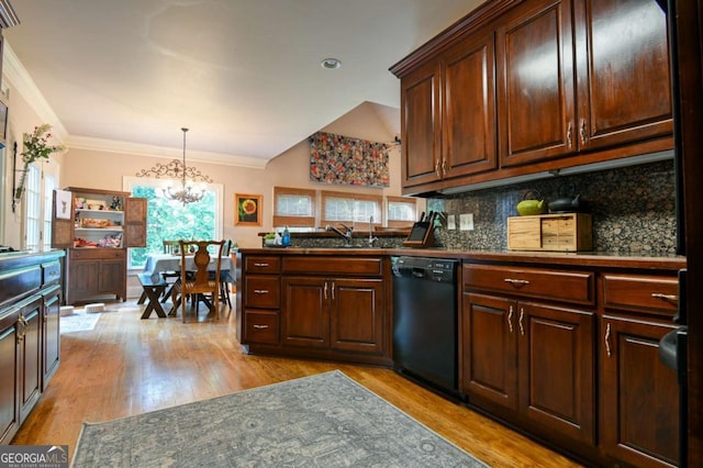 kitchen featuring light wood-type flooring, a chandelier, tasteful backsplash, a sink, and dishwasher