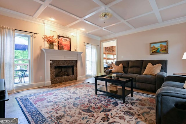 living area featuring a high end fireplace, coffered ceiling, beam ceiling, and ornamental molding