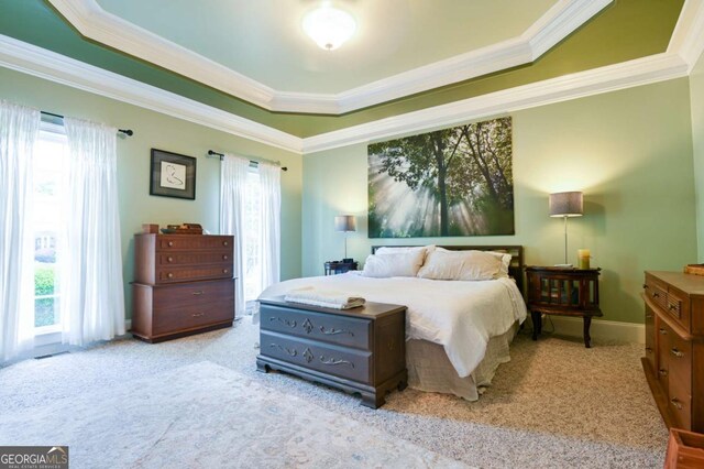 carpeted bedroom with crown molding and multiple windows