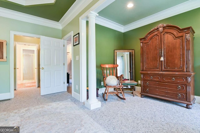 sitting room featuring crown molding, baseboards, carpet, and decorative columns