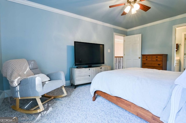 carpeted bedroom featuring a ceiling fan, baseboards, and ornamental molding