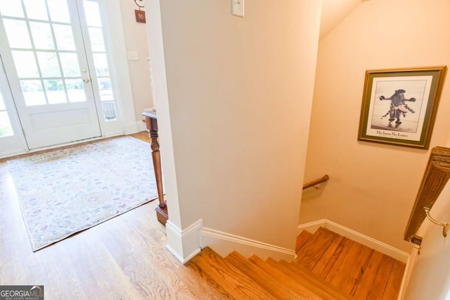 interior space featuring baseboards and wood finished floors