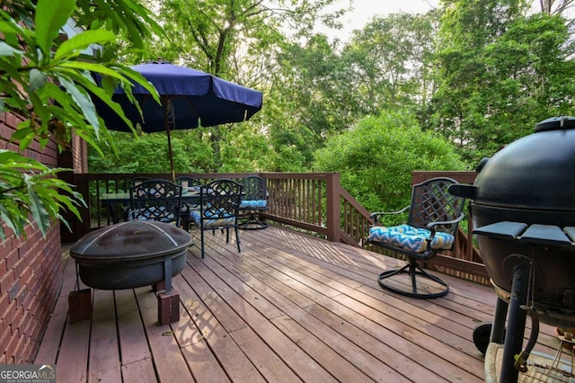 wooden deck with outdoor dining area