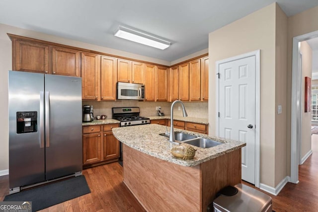 661 Village Field Ct NW, Suwanee, GA 30024 - kitchen with dark wood-type flooring, a sink, backsplash, and stainless steel appliances