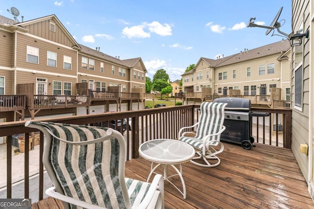 661 Village Field Ct NW, Suwanee, GA 30024 - wooden deck with area for grilling and a residential view