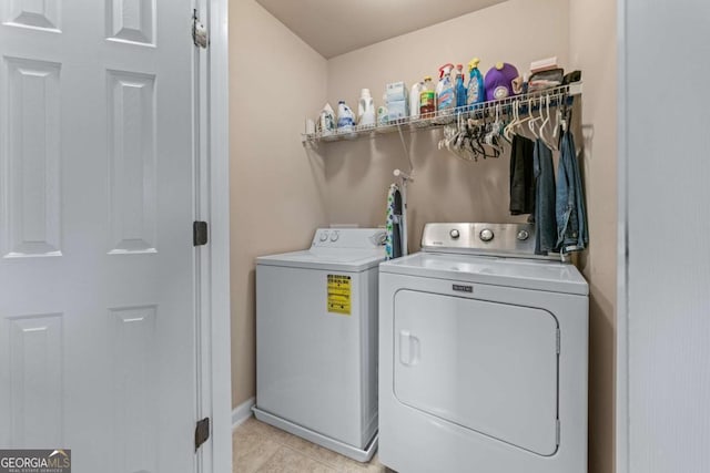 661 Village Field Ct NW, Suwanee, GA 30024 - laundry area featuring laundry area, baseboards, light tile patterned floors, and washer and dryer