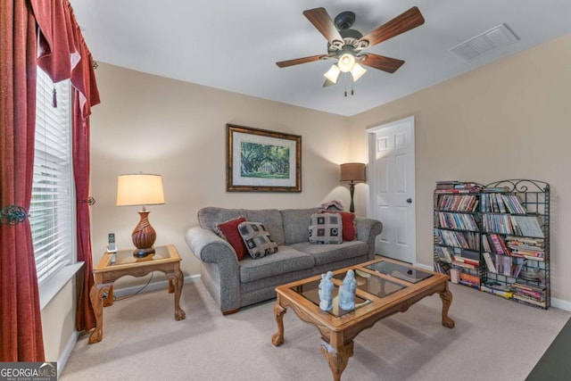 661 Village Field Ct NW, Suwanee, GA 30024 - living area featuring carpet floors, a ceiling fan, baseboards, and visible vents