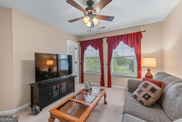 661 Village Field Ct NW, Suwanee, GA 30024 - living room with carpet floors, baseboards, and ceiling fan