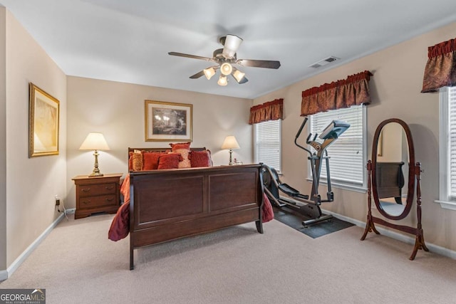 661 Village Field Ct NW, Suwanee, GA 30024 - bedroom featuring light colored carpet, baseboards, ceiling fan, and visible vents