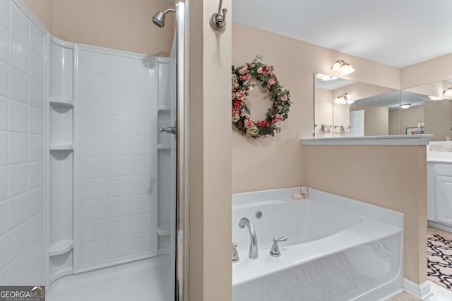 661 Village Field Ct NW, Suwanee, GA 30024 - bathroom featuring vanity, a garden tub, and a stall shower