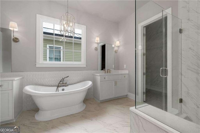 7235 Cordery Rd, Cumming, GA 30040 - full bathroom with a freestanding bath, a shower stall, vanity, marble finish floor, and a chandelier