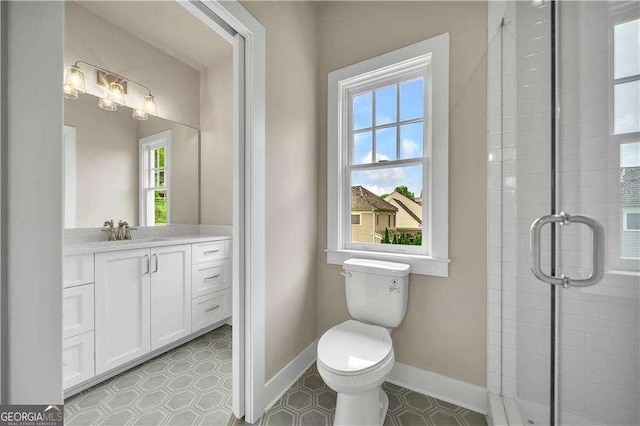 7235 Cordery Rd, Cumming, GA 30040 - bathroom featuring toilet, baseboards, a shower stall, and vanity