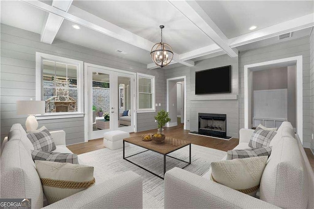 7235 Cordery Rd, Cumming, GA 30040 - living area featuring visible vents, wood finished floors, french doors, and beamed ceiling