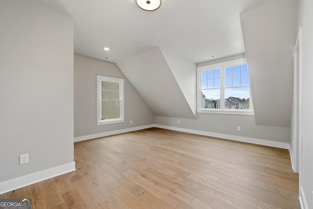 7235 Cordery Rd, Cumming, GA 30040 - bonus room featuring baseboards, light wood finished floors, lofted ceiling, and visible vents