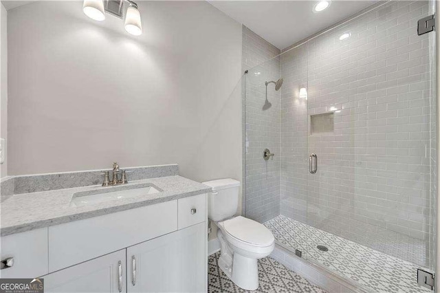 7235 Cordery Rd, Cumming, GA 30040 - full bath featuring vanity, recessed lighting, a stall shower, and toilet