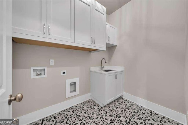 7235 Cordery Rd, Cumming, GA 30040 - laundry area featuring electric dryer hookup, cabinet space, a sink, baseboards, and hookup for a washing machine