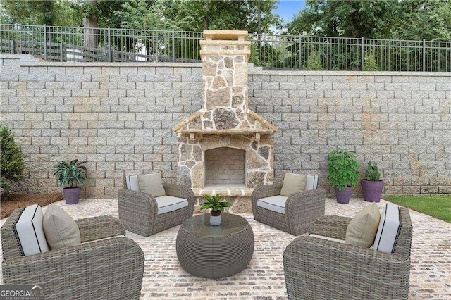7235 Cordery Rd, Cumming, GA 30040 - view of patio / terrace with fence and an outdoor living space with a fireplace