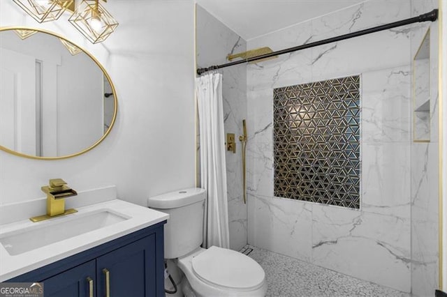 bathroom featuring vanity, curtained shower, and toilet