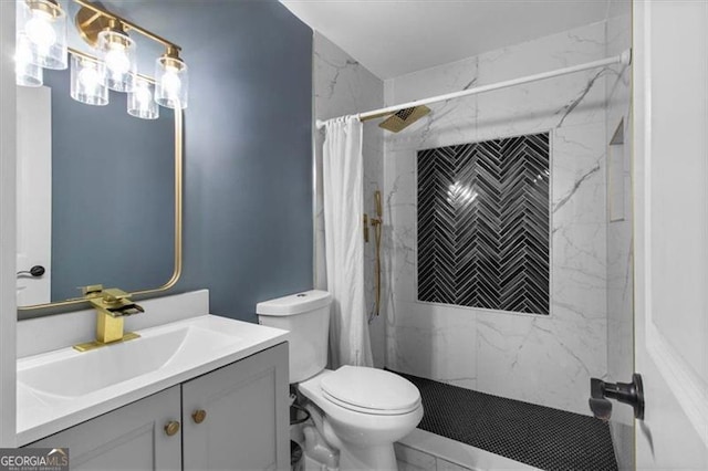 full bathroom featuring vanity, marble finish floor, a shower with shower curtain, and toilet