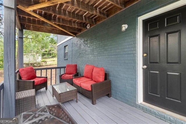 deck featuring outdoor lounge area
