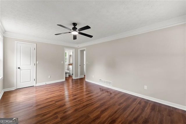 2979 Overwood Ln SW, Snellville, GA 30078 - unfurnished bedroom with wood finished floors, a textured ceiling, crown molding, a ceiling fan, and ensuite bath