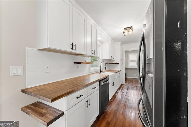 2979 Overwood Ln SW, Snellville, GA 30078 - kitchen featuring freestanding refrigerator, dishwasher, butcher block counters, dark wood finished floors, and white cabinetry
