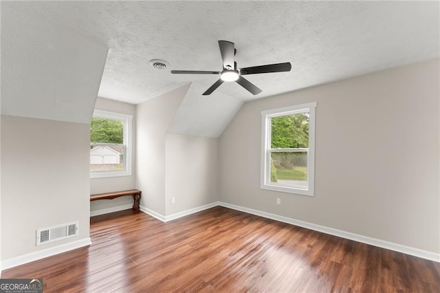 2979 Overwood Ln SW, Snellville, GA 30078 - additional living space with wood finished floors, healthy amount of natural light, vaulted ceiling, and ceiling fan