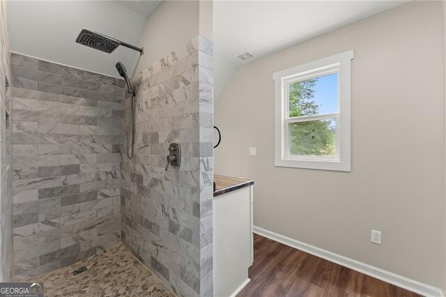 2979 Overwood Ln SW, Snellville, GA 30078 - bathroom with a tile shower and wood finished floors