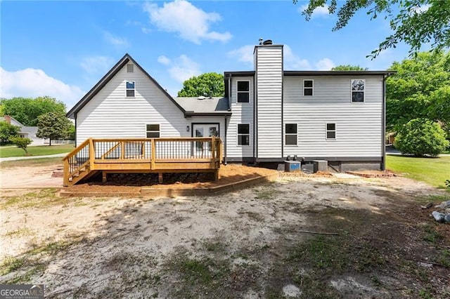 2979 Overwood Ln SW, Snellville, GA 30078 - rear view of property with a deck and a chimney