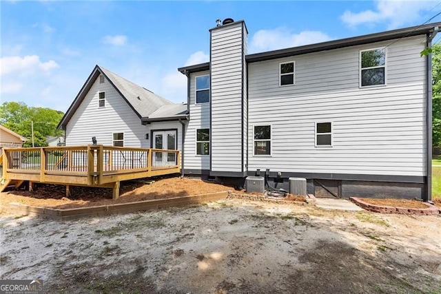 2979 Overwood Ln SW, Snellville, GA 30078 - back of house featuring a chimney, a deck, and french doors