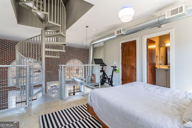 791 Wylie St SE Unit 912, Atlanta, GA 30316 - bedroom featuring visible vents, concrete floors, and brick wall
